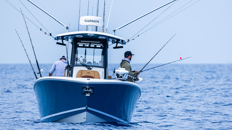 boat on water with fishers